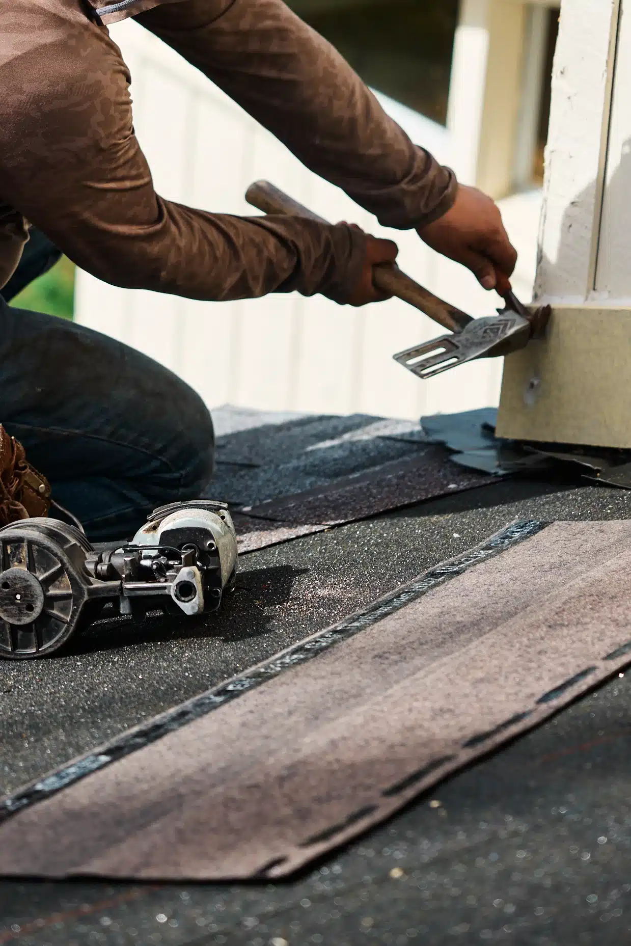 Contractor repairing damaged shingles during a roof repair Nashville project - Southern Roofing Co.
