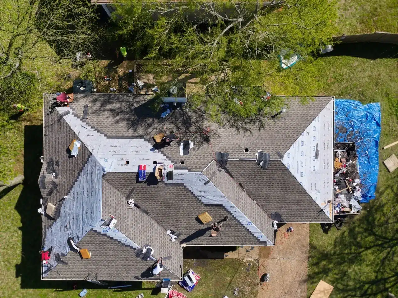 Storm damage roof repair Donelson, TN — aerial view of a tarped roof after storm damage