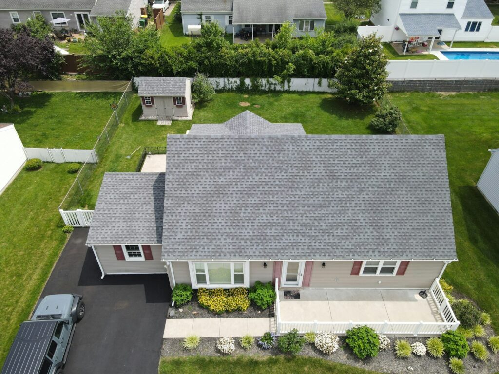 Aerial view of a residential home with grey asphalt shingles in Bellevue, TN