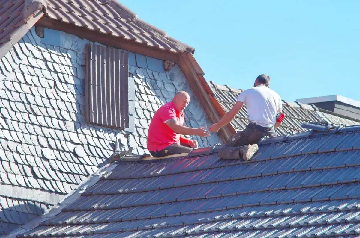 Roofers installing new shingles — Franklin, TN