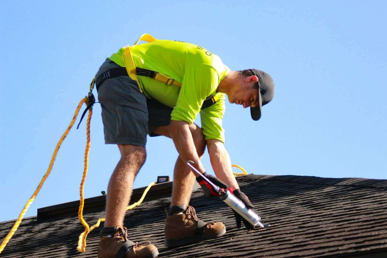 Roofer installing shingles on a residential roof in Hermitage, TN