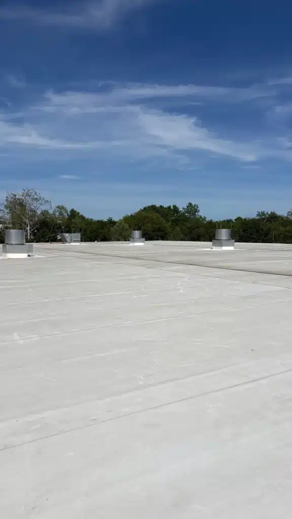 Completed commercial flat roof membrane with rooftop vents in Middle Tennessee