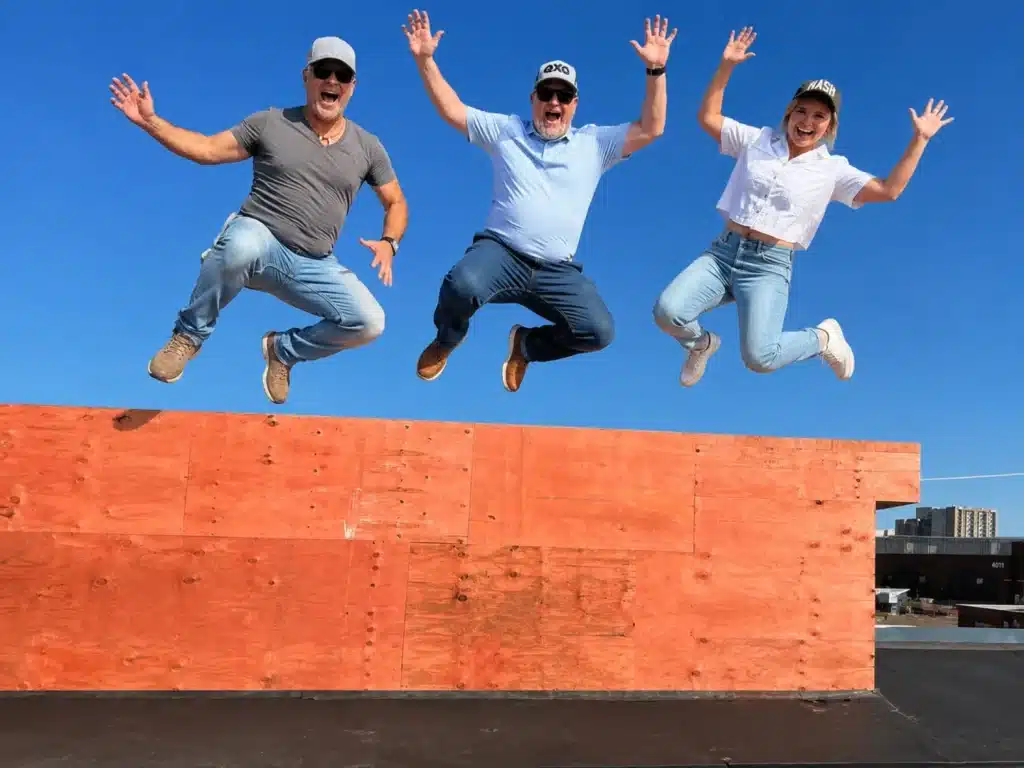 Southern Roofing Co. team celebrating on a commercial rooftop in Nashville, TN